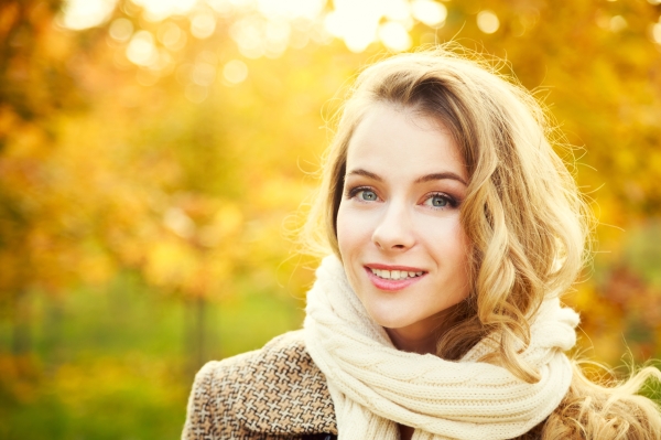 Young Fashion Woman on Autumn Background